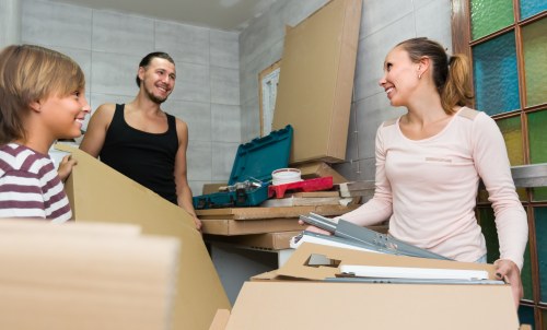 Professional movers packing a home for relocation
