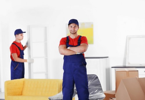 Professional commercial movers handling office equipment