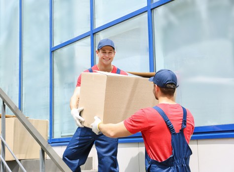 Moving crew loading furniture from a Victorian terrace