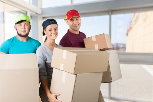 Man with Van helping to load furniture into a moving van
