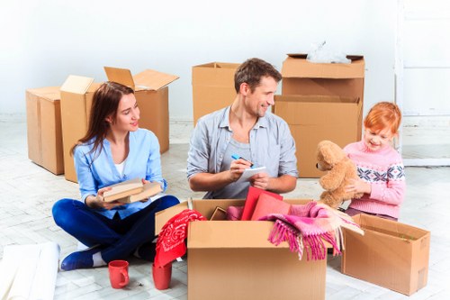 Movers handling large furniture safely
