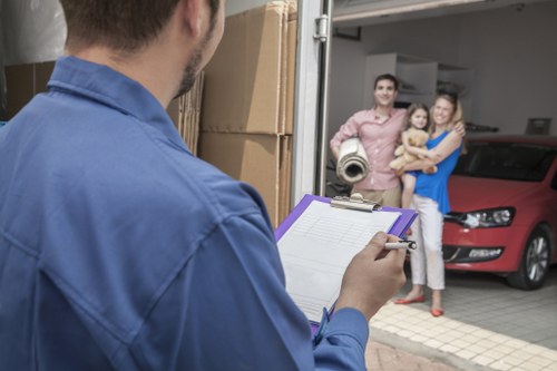 Volunteers loading donated furniture into a van