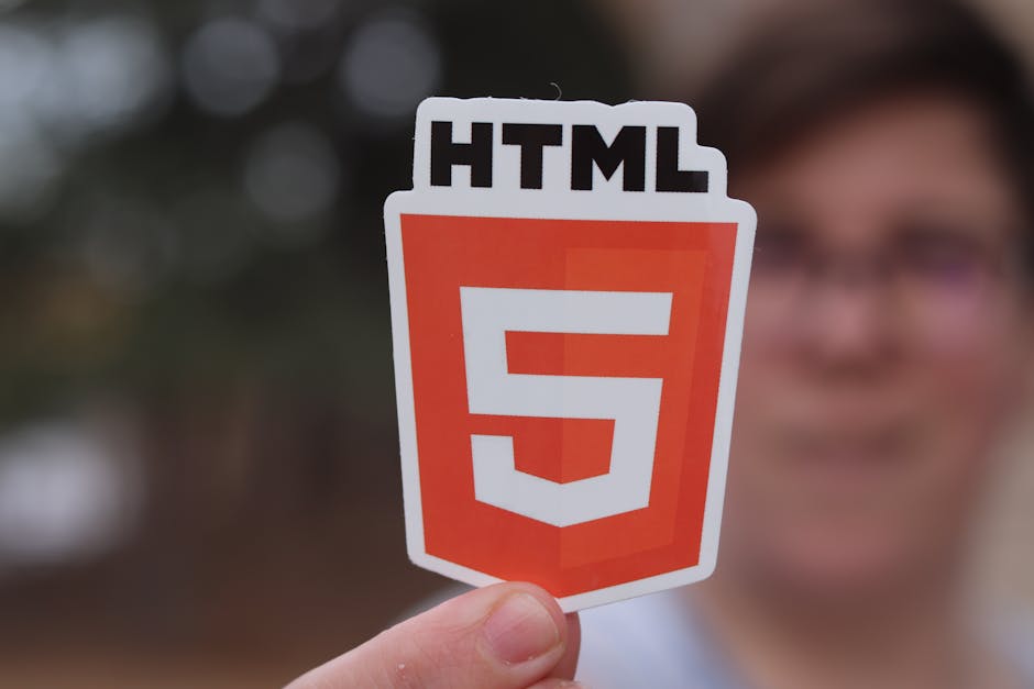 A computer screen displaying a code editor with an open HTML file named 'index.html', showing lines of code including the DOCTYPE declaration, html, head, and body tags, along with meta tags, a title,